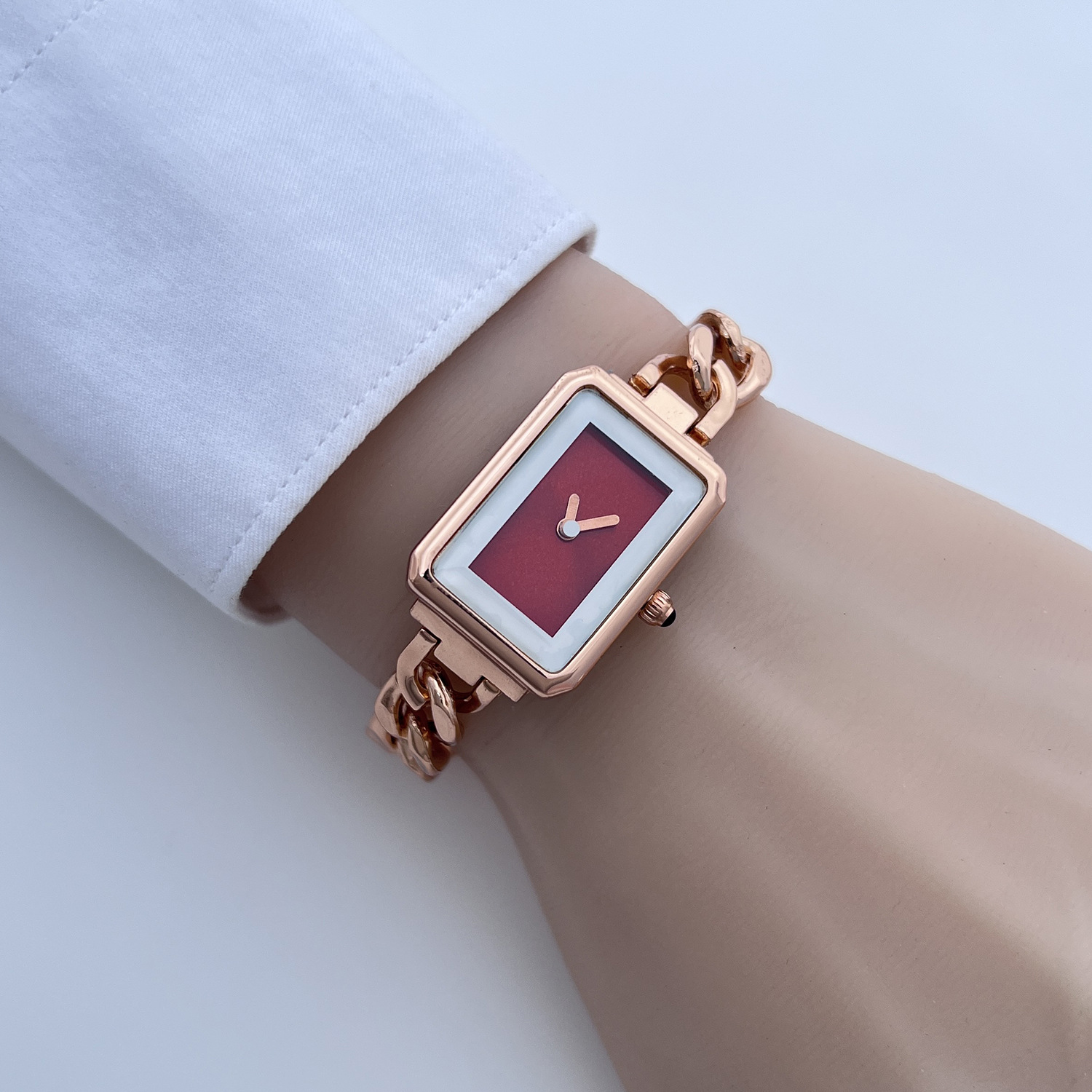 Rose gold case with white edge glass and red face (separate watch)