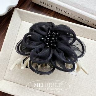 Black camellia white pumpkin clip